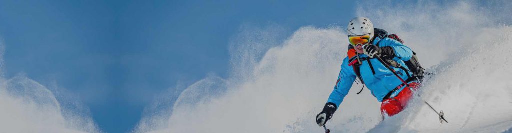 Skiing down Mt Hotham on a bright, clear day